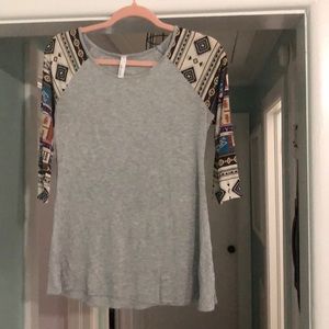 Boutique style top with Aztec print sleeves